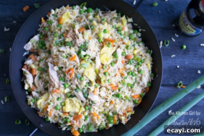 Chicken Fried Rice: every kitchen needs this go-to recipe for simple, delicious chicken fried rice! Whip up this one-skillet meal in 30-minutes! #chicken #friedrice #dinner #chickenfriedrice #homemade #stirfry #stovetopmeals #oneskillet #easydinner #skilletrecipes #onepan #leftovers Chicken fried rice in skillet