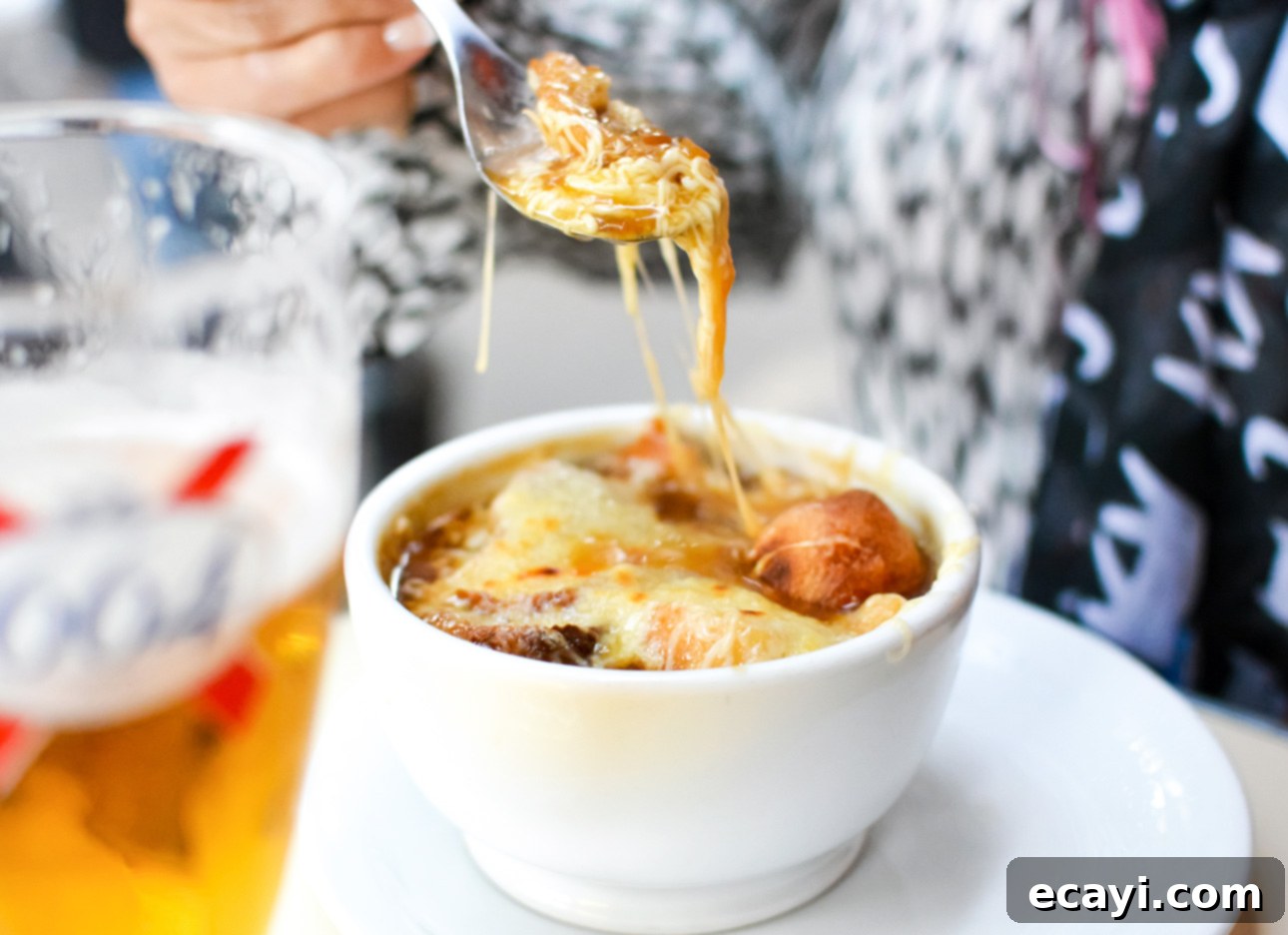 Perfect Homemade French Onion Soup 3 Classic French onion soup served in a Parisian café // FoodNouveau.com