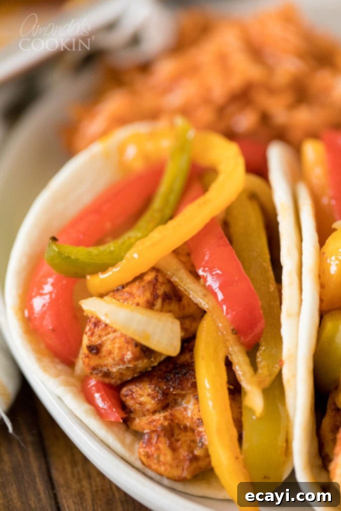 One-Pan Chicken Fajitas 6 Close-up of a perfectly cooked chicken fajita with colorful peppers and onions