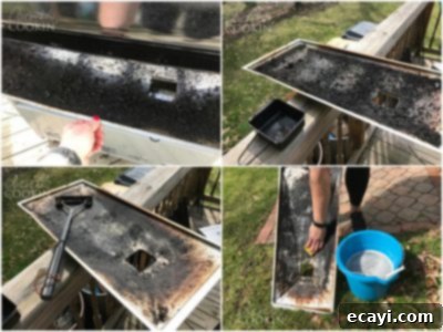 The Gas Grill Deep Clean: Restore Its Shine & Performance 17 cleaning the bottom tray of a grill