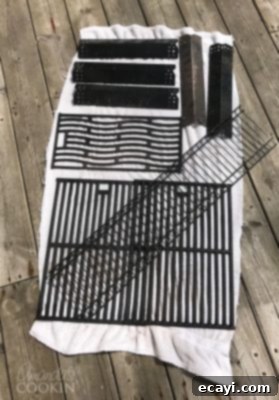 The Gas Grill Deep Clean: Restore Its Shine & Performance 18 grill parts drying on towel
