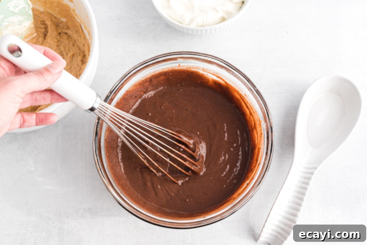 Decadent Chocolate Peanut Butter Stack 10 whisking instant pudding in a bowl