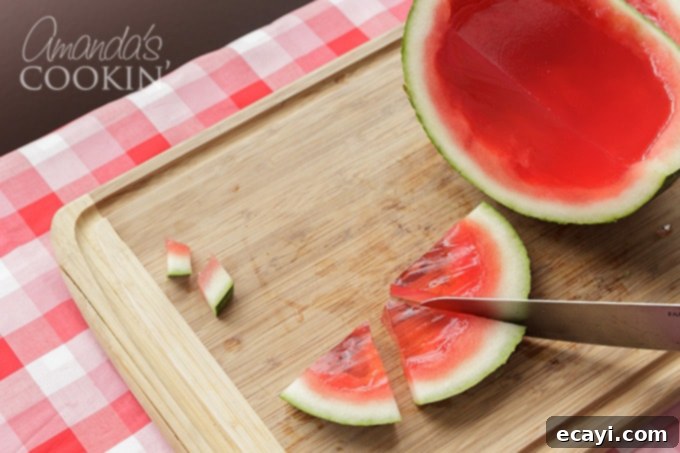 These Watermelon Jello Shots are a party favorite! Jello shots are perfect to bring to BBQ's, potlucks, camping or any type of gathering. slicing watermelon jello shots