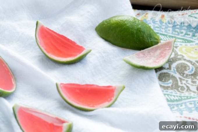 These Watermelon Jello Shots are a party favorite! Jello shots are perfect to bring to BBQ's, potlucks, camping or any type of gathering. lime rinds filled with watermelon jello