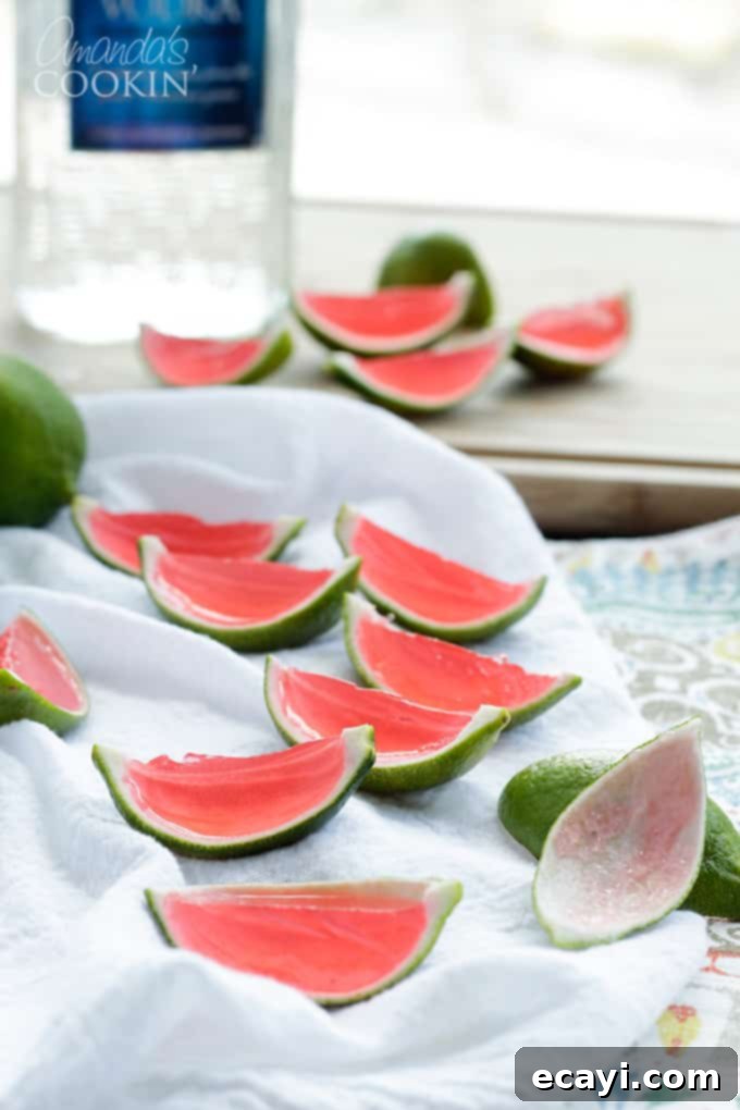 These Watermelon Jello Shots are a party favorite! Jello shots are perfect to bring to BBQ's, potlucks, camping or any type of gathering. watermelon jello shots inside the rind of a lime