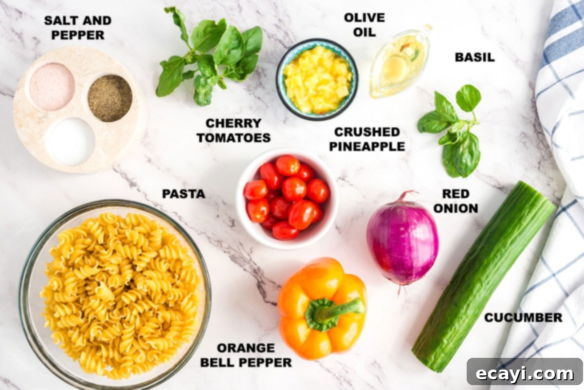 Minimal dressing ingredients and maximum fresh vegetables, this summer pasta salad will be the hit of your summer parties and holiday get togethers. Ingredients for Summer Pasta Salad laid out on a wooden surface, including pasta, vegetables, and olive oil