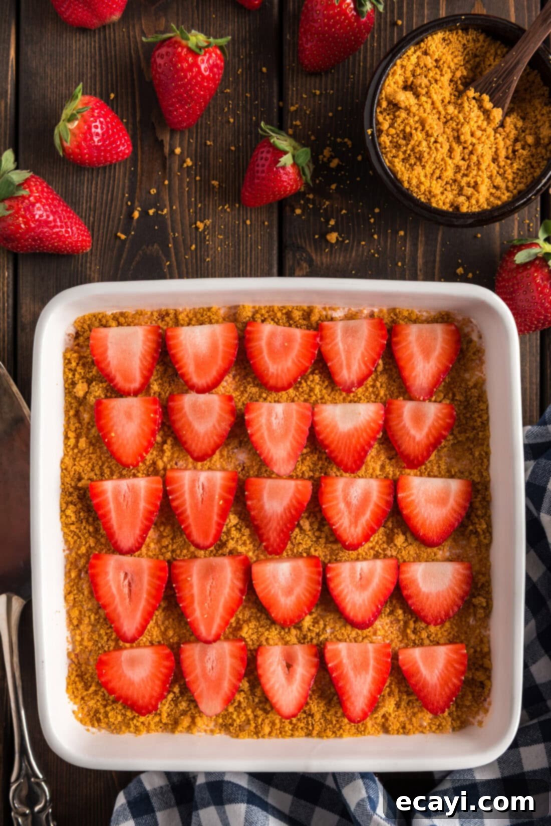 Blush Berry Bliss 13 A baking dish filled with the creamy and vibrant Strawberry Dream Dessert, ready to be served.