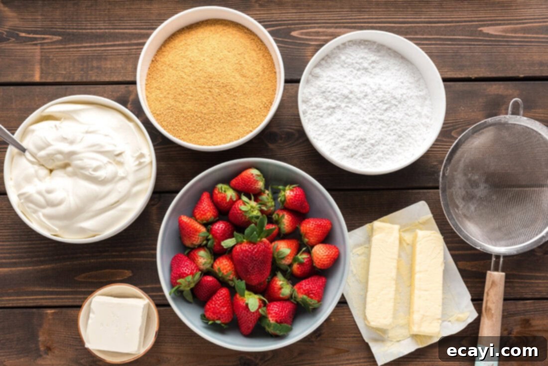 Blush Berry Bliss 4 All the fresh ingredients laid out for making the Strawberry Dream Dessert, including strawberries, cream cheese, butter, and graham crackers.