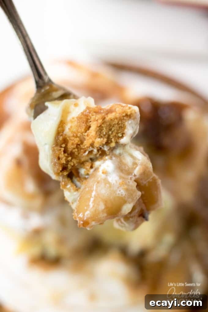 The final, mouth-watering bite of Banana Cream Lush with Bananas Foster. Banana cream lush on fork, ready to be enjoyed
