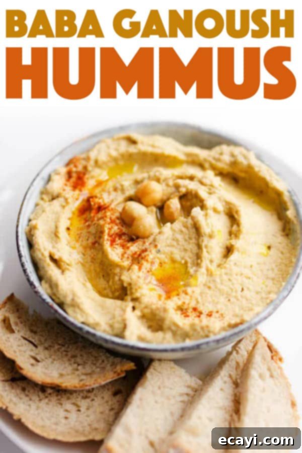 Serve this delicious Baba Ganoush Hummus as a healthy appetizer or a versatile spread for any meal. #eggplant #hummus #vegetarian #chickpeas #healthyrecipes #dips #appetizers A vibrant bowl of Baba Ganoush Hummus, ready to be served and enjoyed