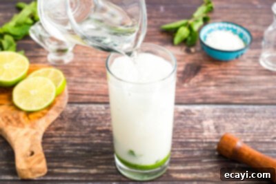 Island Coconut Dream 14 adding club soda to glass