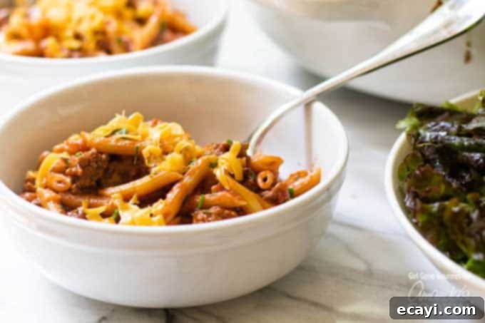 A twist on a classic, this one pot sloppy joe pasta is easy to make and has everything you love about sloppy joes with no hamburger buns required. #sloppyjoe #pastarecipes #comfortfood #onepotmeals sloppy joe pasta in bowl