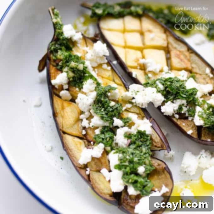 Roasted Eggplant with Bright Mint Dressing 3 eggplant on a plate with feta cheese