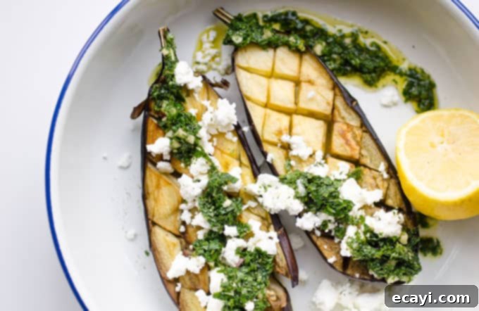 Roasted Eggplant with Bright Mint Dressing 4 eggplant on a plate with feta cheese