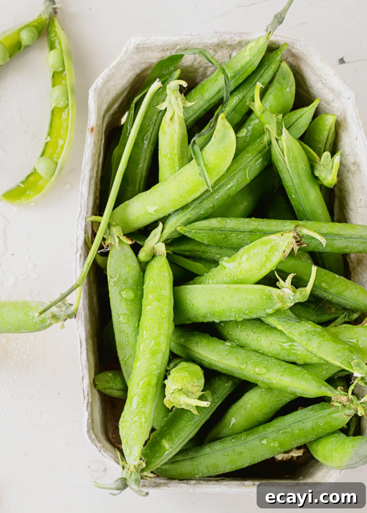 Verdant Pea Risotto 3 A basket overflowing with fresh, vibrant green sweet peas