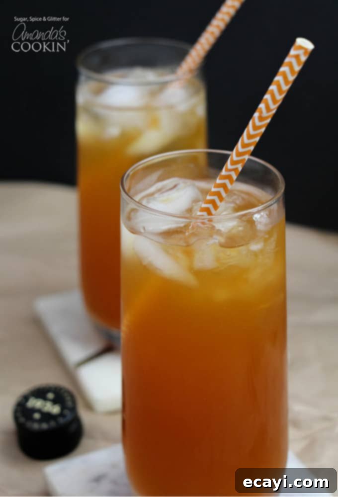 This Caramel Pumpkin Cocktail is a delicious way to enjoy all of your favorite fall flavors like caramel and pumpkin, in one icy cocktail! #fallcocktails #pumpkincocktail #pumpkindrinks #cocktails #applecidercocktails #falldrinks #kahluadrinks #saltedcaramel #kahlua Caramel Pumpkin Cocktail in tall glasses with straws