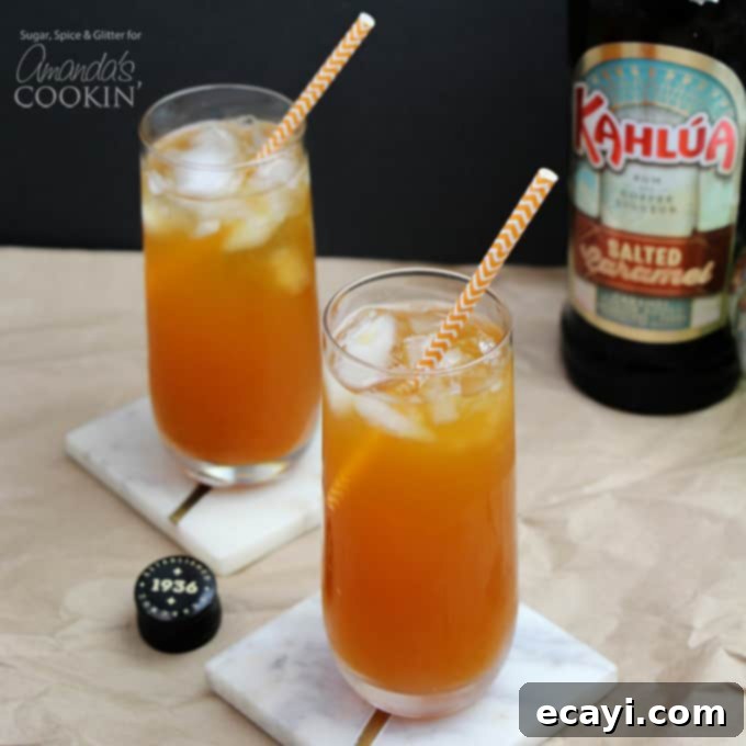 This Caramel Pumpkin Cocktail is a delicious way to enjoy all of your favorite fall flavors like caramel and pumpkin, in one icy cocktail! #fallcocktails #pumpkincocktail #pumpkindrinks #cocktails #applecidercocktails #falldrinks #kahluadrinks #saltedcaramel #kahlua Caramel pumpkin cocktails with straws and salted caramel kahlua