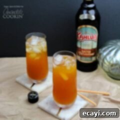 Spiced Pumpkin Caramel Dream 2 two tall cocktails with Kahlua in background