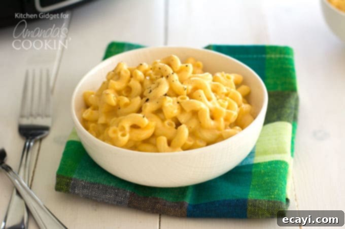 Creamy slow cooker macaroni and cheese, a perfect side dish or main meal. #crockpot #macandcheese #dinner #slowcooker a perfect serving of creamy slow cooker mac and cheese in a bowl