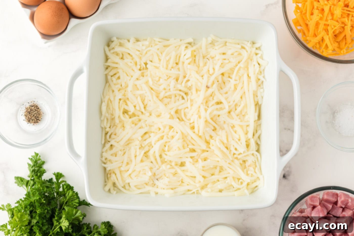 Savory Ham and Cheese Morning Bake 5 Cheese evenly spread in a baking dish