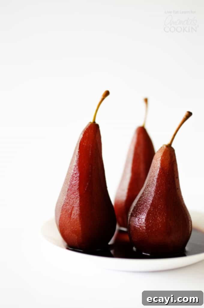 Luscious Red Wine Pears 2 Red wine stewed pears on a plate with spices