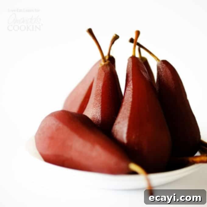 Luscious Red Wine Pears 3 several stewed pears on a plate