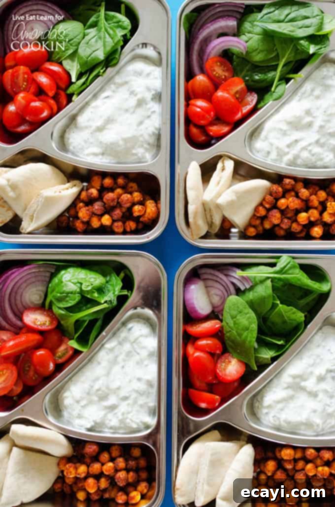 Mediterranean Chickpea Gyro Packs 2 Four colorful boxes filled with vegetarian chickpea gyros, pita bread, and fresh vegetables, ready for meal prep.