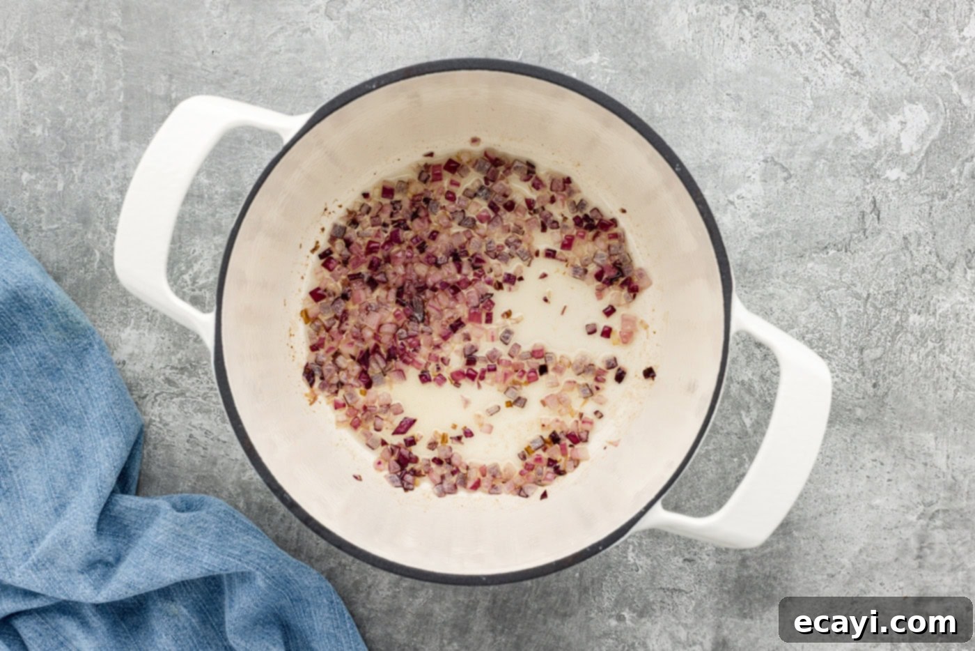 Hearty Veggie Rice Soup 5 chopped red onion in a pot with olive oil, gently sautéing