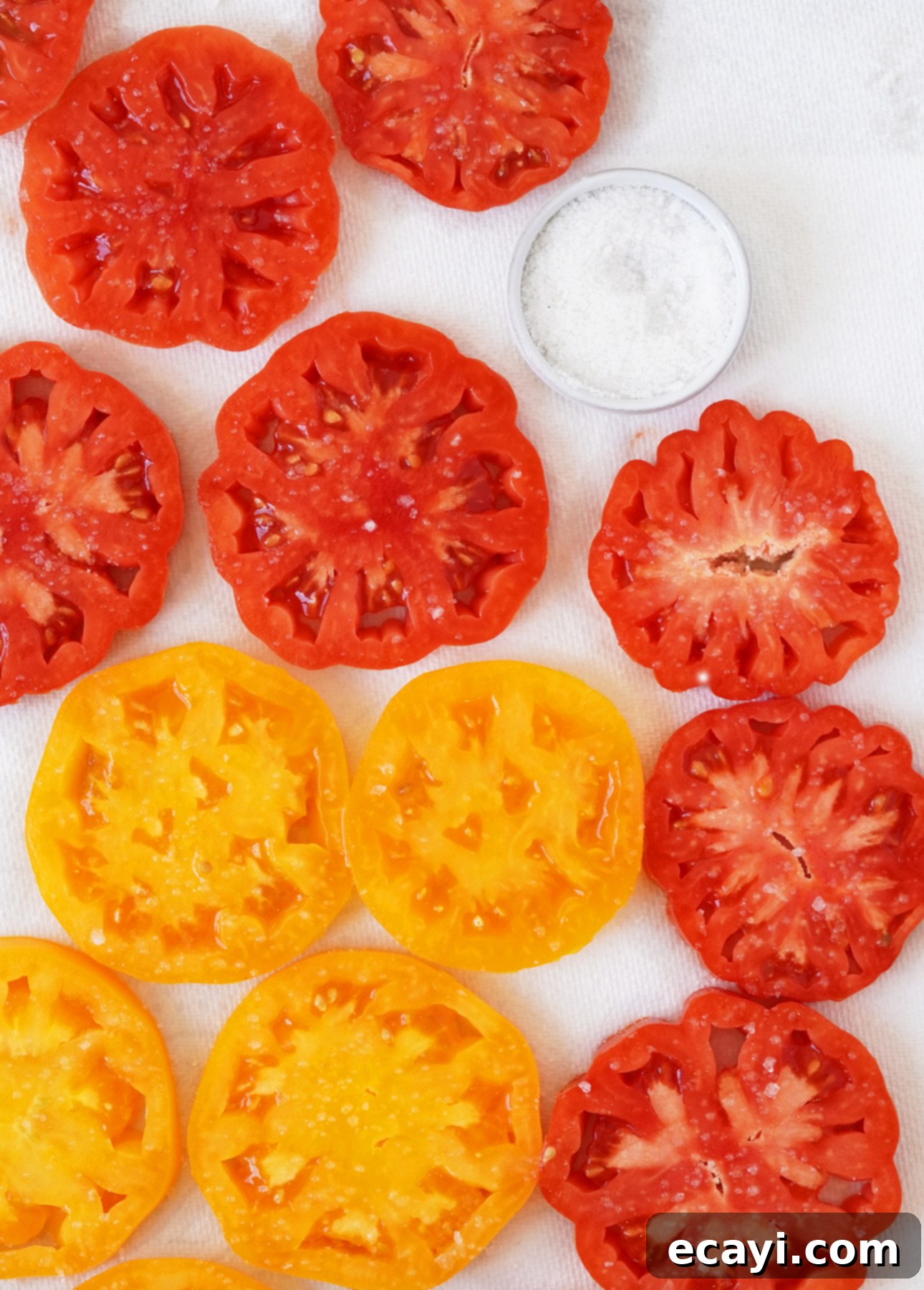 Vibrant Heirloom Tomato Crostata with Handcrafted Pesto 6 Salting and draining Heirloom tomatoes to make a crostata // FoodNouveau.com