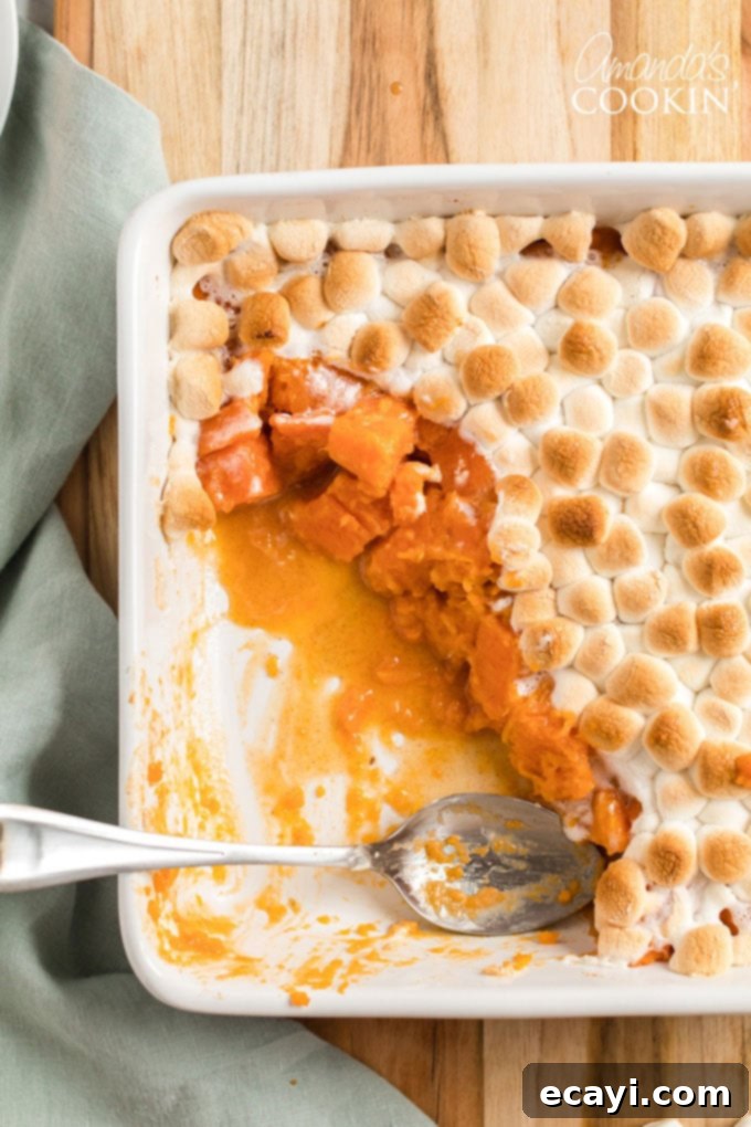 Caramelized Yams 2 pan of candied yams with a spoon