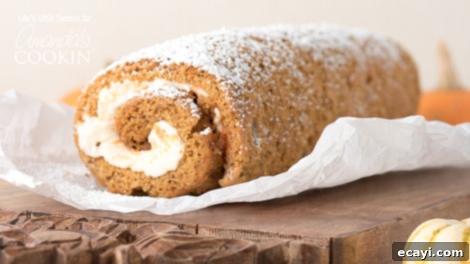 Pumpkin roll recipe for the holidays. A freshly baked pumpkin roll cake, dusted with powdered sugar, presented on a wooden cutting board with a knife, inviting guests to enjoy a slice of fall's favorite dessert.