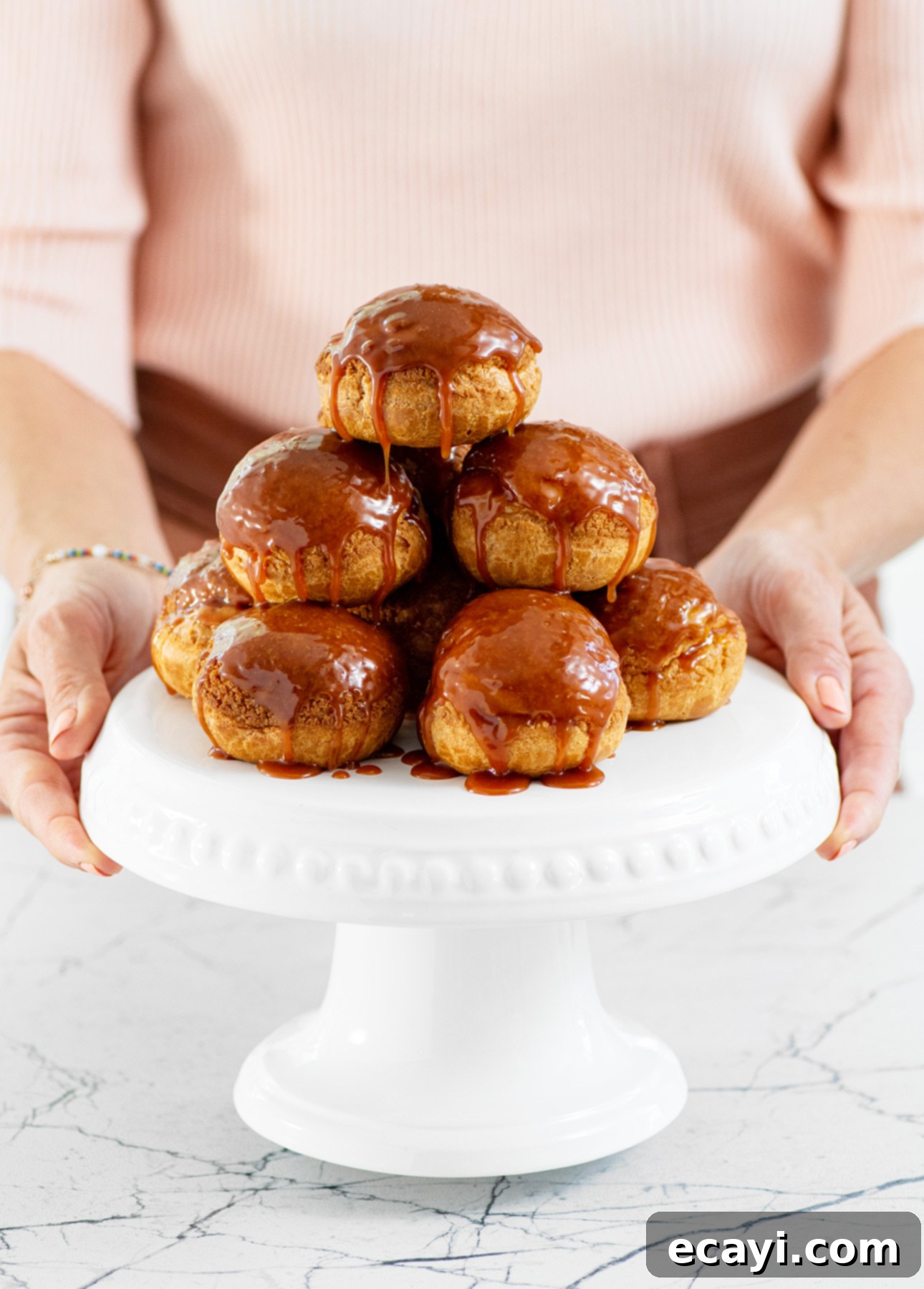 Delicious Salted Caramel Cream Puffs on a serving platter, perfect for any occasion.