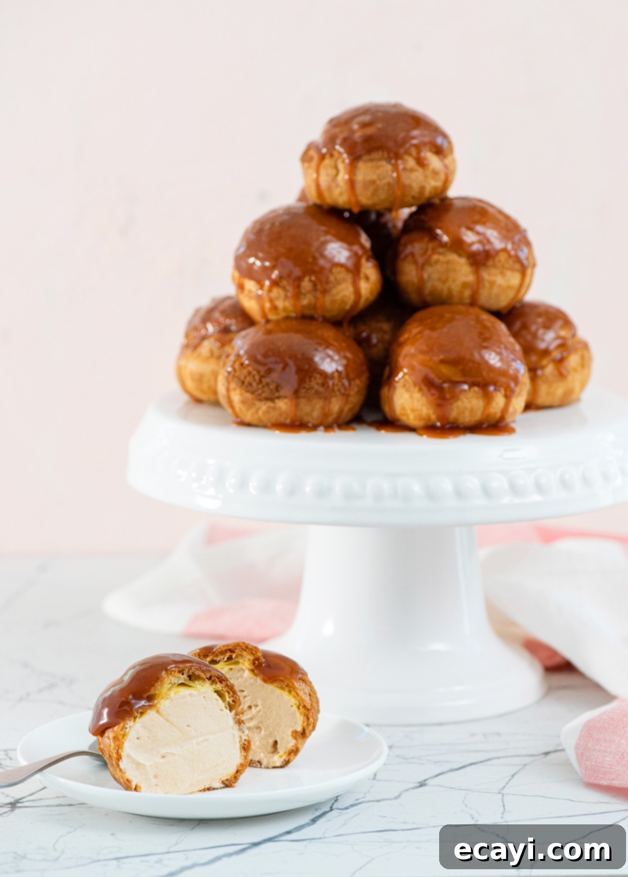 A collection of salted caramel cream puffs, beautifully arranged and ready to be served.