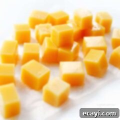 Creamsicle Dream Chews 2 Close-up of square-cut orange creamsicle gummies, vibrant and refreshing
