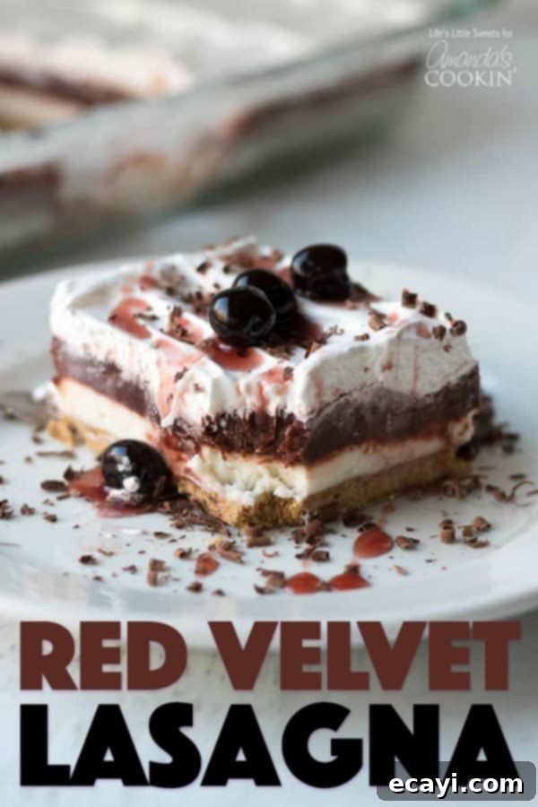 This Red Velvet Lasagna is a layered, no-bake dessert recipe with a crunchy graham cracker crust, cream cheese layer and a red chocolate pudding layer. #lasagnadessert #dessert #dessertrecipes #redvelvet #onepandessert #valentinesday #chocolate #nobakedessert Full Red Velvet Lasagna Dessert in a 9x13 inch pan, showcasing its beautiful layers and festive appeal