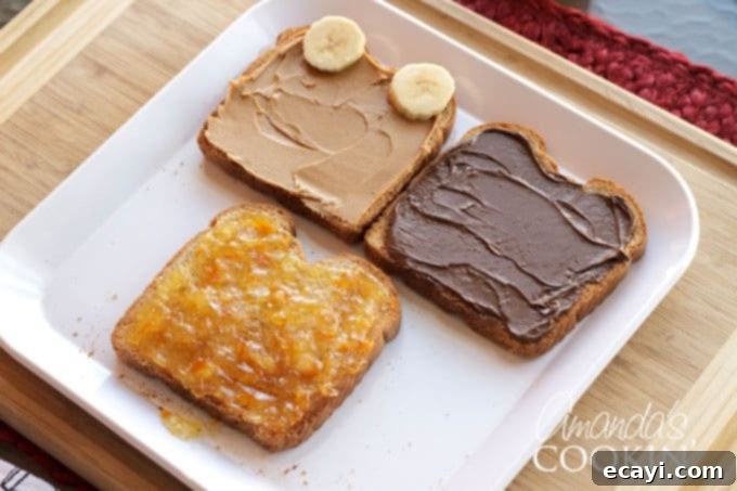 Crafting this bear toast is quick and easy, making it the ideal food-craft activity to do with your children in under 10 minutes! Step 2: Toasting bread and spreading chosen sweet spread (Nutella, peanut butter, or marmalade) while warm for the teddy bear toast.
