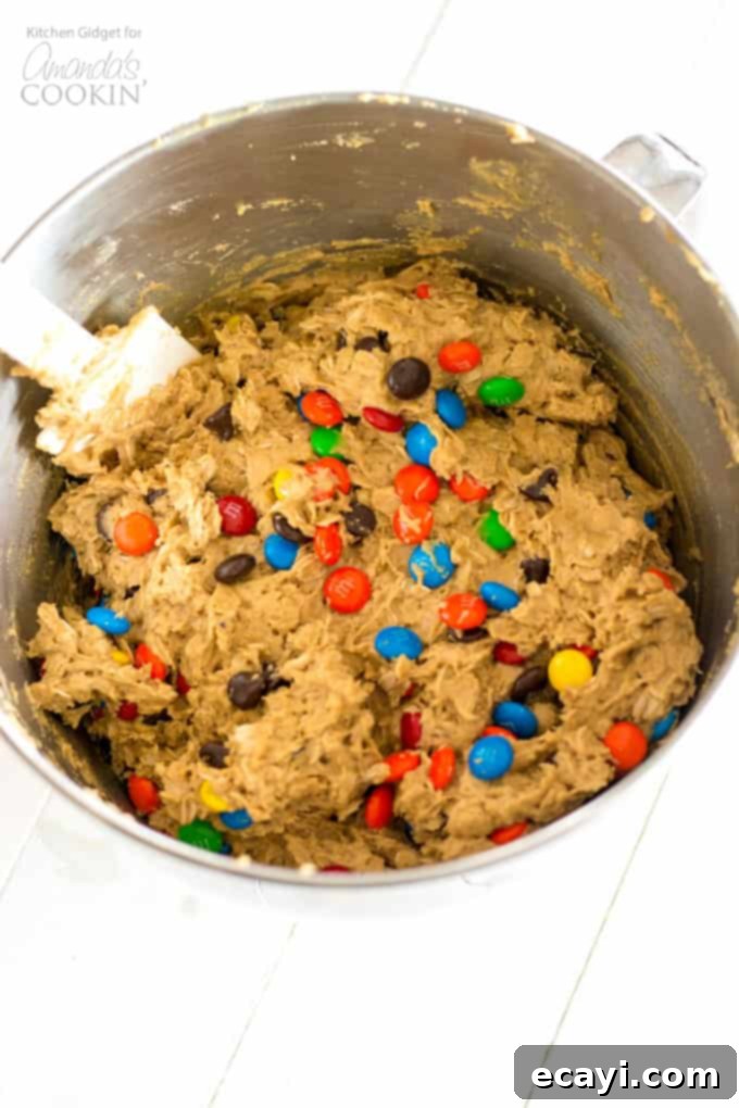 Monster Cookies: peanut butter and oatmeal cookies packed with chocolate chips and colorful M&M's. These cookies are fun to make with the kids! #monstercookies #m&ms #cookierecipes #bestdessertrecipes #chocolate #peanutbutter #peanutbuttercookies #oatmeal #oatmealcookies Ingredients for Monster Cookies in a large mixing bowl