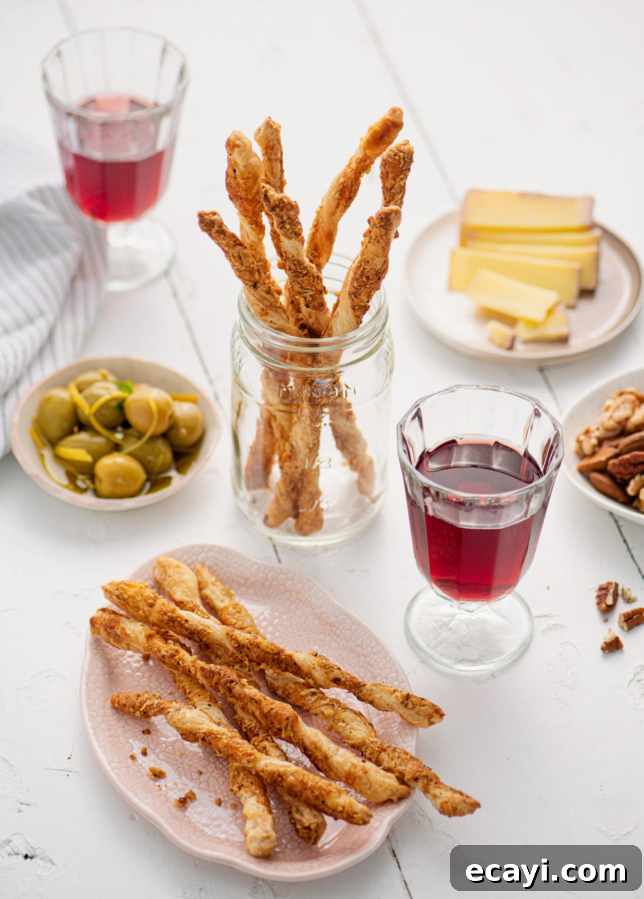 Effortless Cheesy Twists 3 Unbaked cheese straws on parchment paper