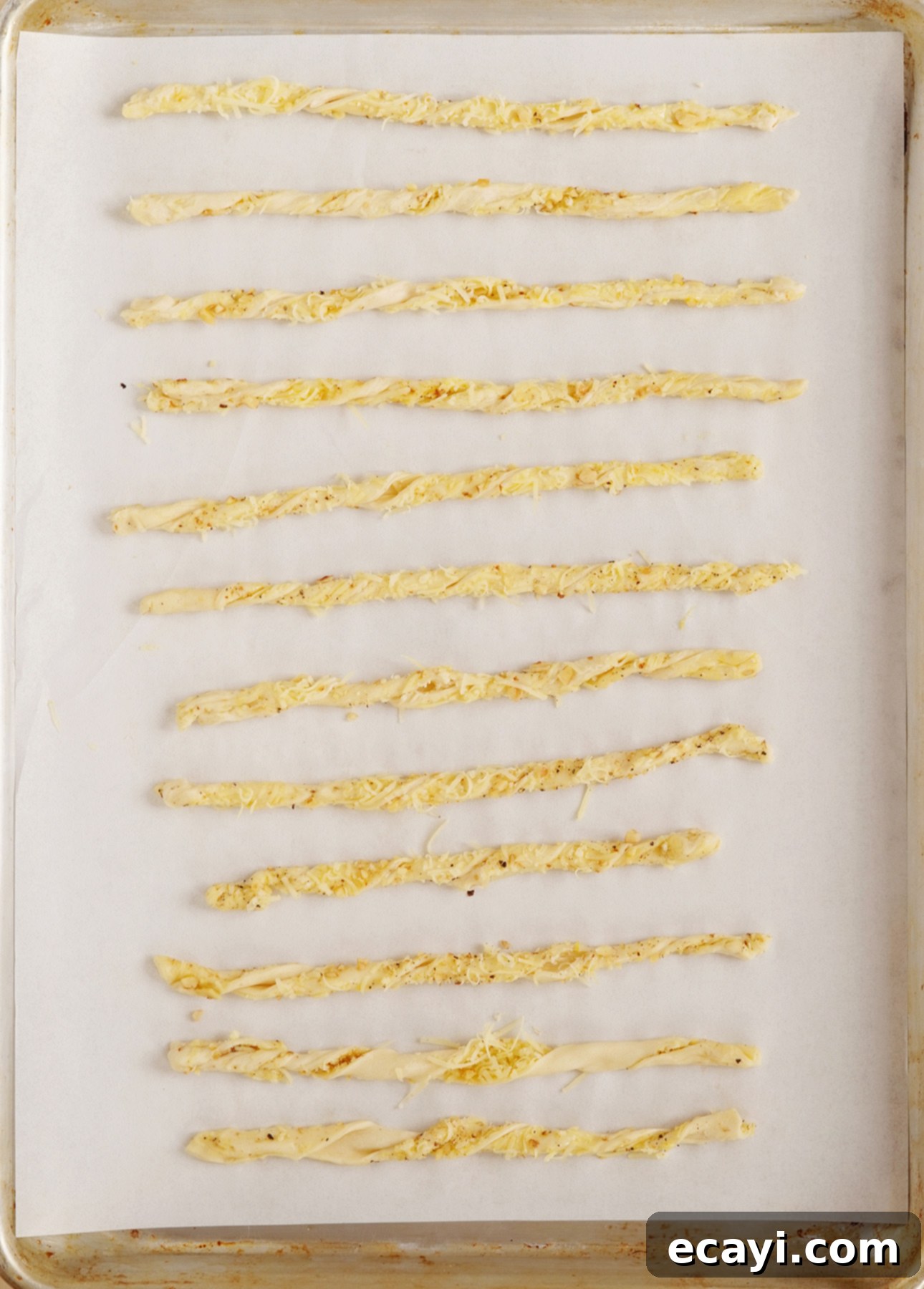 Effortless Cheesy Twists 4 Baked cheese straws on a cooling rack
