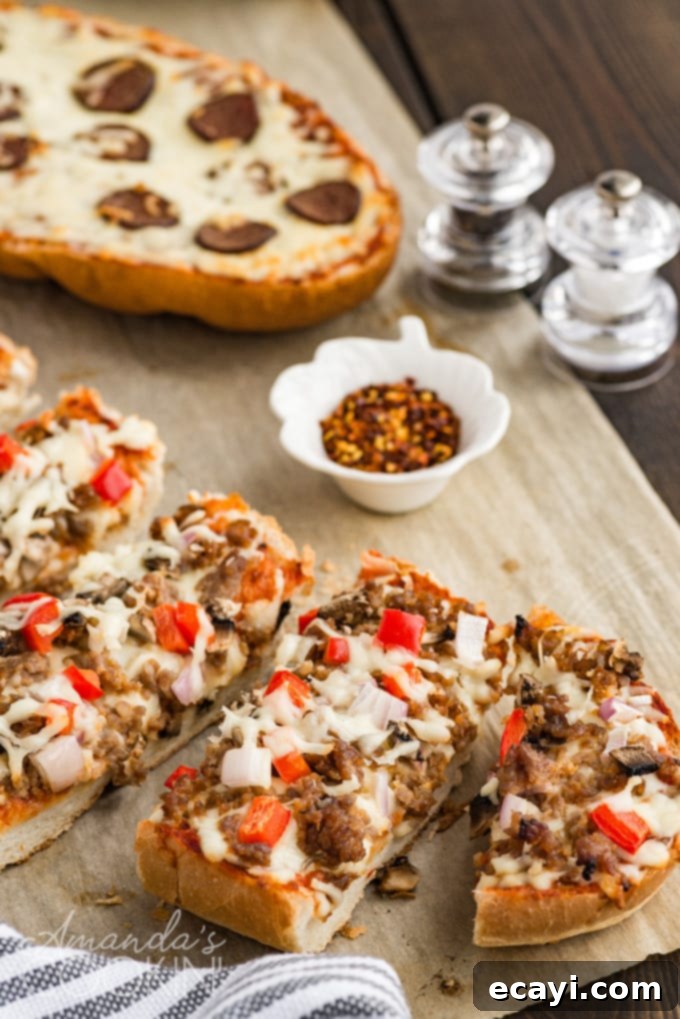 Homemade French Bread Pizza: A quick and tasty dinner solution with customizable toppings. #frenchbreadpizza #easypizza #homemadepizza #dinnerideas #pizza #recipes Deliciously sliced French bread pizza ready to be served