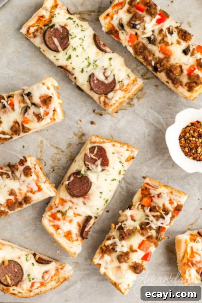 Perfectly baked individual French bread pizza slices for a delicious meal. #pizzanight #quickdinner #frenchbreadrecipe Individual slices of homemade French bread pizza on a serving plate
