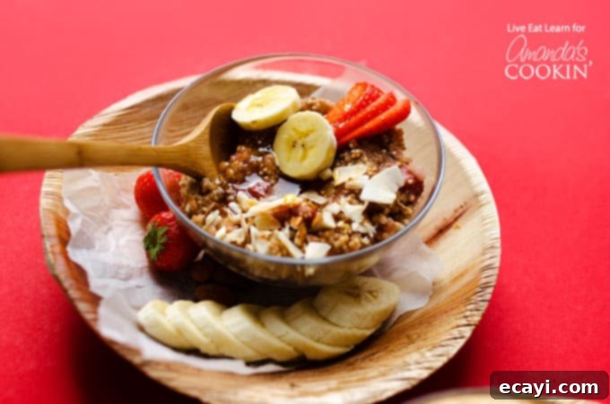 This Slow Cooker Breakfast Quinoa is a dump-it and forget-it kind of meal. Throw all the makings of a delicious breakfast in your slow cooker. #slowcooker #crockpot #breakfast #healthybreakfast #bananas #quinoa #breakfastrecipes #easybreakfast Breakfast quinoa in a bowl with fruit