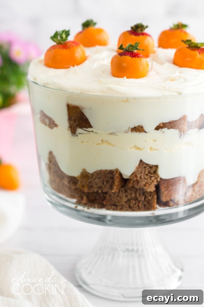 This carrot cake trifle has layers of moist carrot cake and no-bake cheesecake filling then topped with adorable strawberry  carrot cake trifle with orange dipped chocolate strawberry carrots