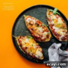 Cheesy Stuffed Eggplant Parmesan 6 cooked eggplant on a black plate