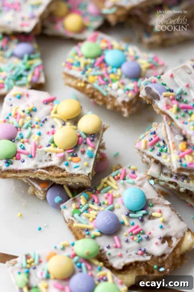 This Easter crack is a festive Saltine Toffee. An easy-to-make recipe using simple pantry ingredients like white chocolate, sprinkles, and Easter candies. #easterdessert #easter #eastercandy #saltinetoffee #saltinecrack #whitechocolate #holidaydessert Festive Easter Crack candy