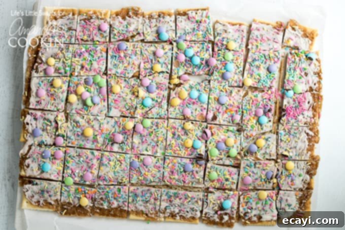 This Easter crack is a festive Saltine Toffee. An easy-to-make recipe using simple pantry ingredients like white chocolate, sprinkles, and Easter candies. #easterdessert #easter #eastercandy #saltinetoffee #saltinecrack #whitechocolate #holidaydessert Easter Crack Recipe: festive saltine toffee