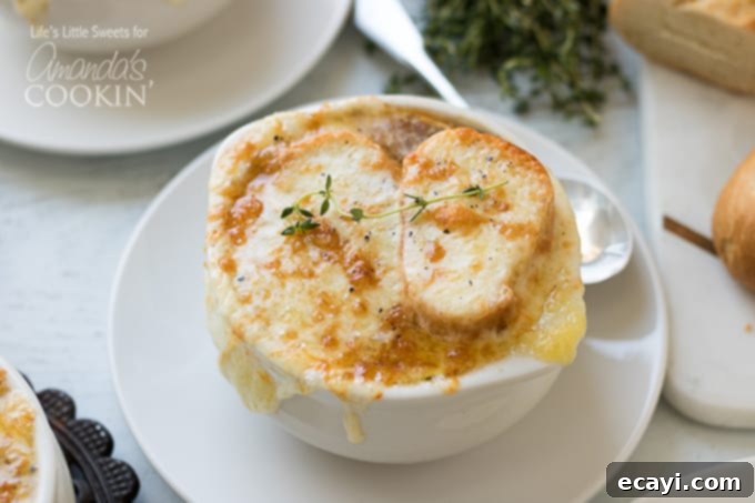 Carefully selected ingredients are key to a truly authentic and delicious homemade French Onion Soup. Ingredients for French Onion Soup including sliced baguette, a selection of cheeses, and fresh herbs