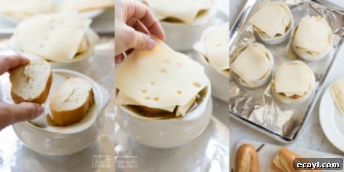 Preparing the classic cheesy topping for French Onion Soup: layering baguette slices with a blend of provolone, Swiss, and Muenster cheeses. Adding slices of baguette and a variety of cheeses on top of French Onion Soup before broiling