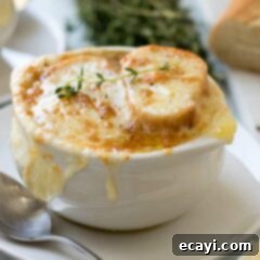 The Ultimate French Onion Soup 2 A beautifully presented bowl of French Onion Soup with a golden, cheesy crust