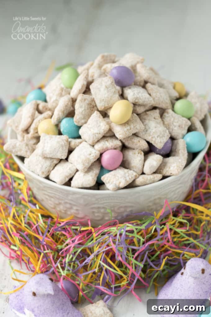 Easter Muddy Buddies are a sweet and salty snack with cereal. Then coated in white chocolate & peanut butter, customized with your favorite Easter candies. #snack #easter #easterdessert #easterrecipes #muddybuddy #puppychow #candy #chexmix #whitechocolate Easter Muddy Buddies/Easter Puppy Chow recipe